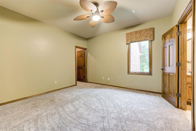 1918 Winding Ridge Rd, Edmond, OK 73034 - unfurnished bedroom featuring light carpet and a ceiling fan