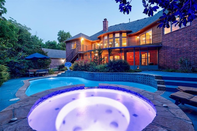 1918 Winding Ridge Rd, Edmond, OK 73034 - view of pool featuring stairway, a pool with connected hot tub, and a patio