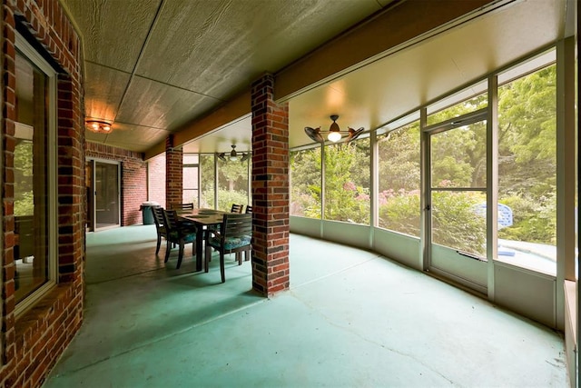 1918 Winding Ridge Rd, Edmond, OK 73034 - sunroom with outdoor dining space and ceiling fan