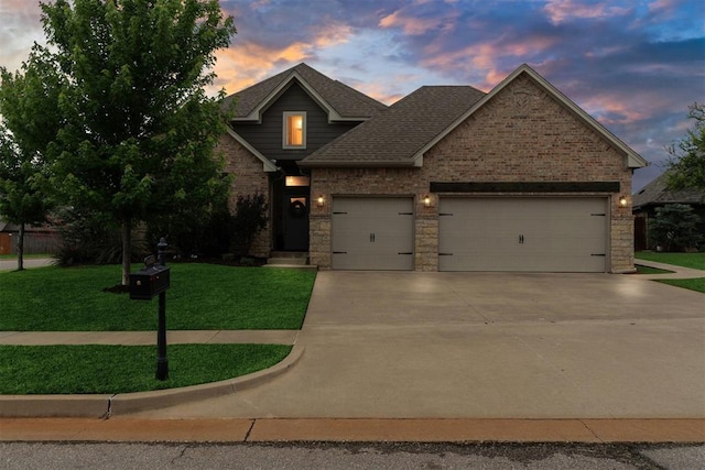 18813 Windy Way Rd, Edmond, OK 73012 - view of front facade featuring an attached garage, concrete driveway, a front lawn, brick siding, and a shingled roof