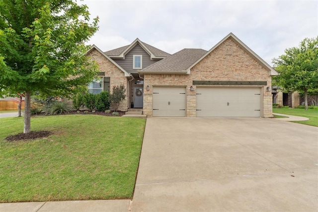 18813 Windy Way Rd, Edmond, OK 73012 - view of front facade featuring an attached garage, concrete driveway, a front lawn, brick siding, and roof with shingles