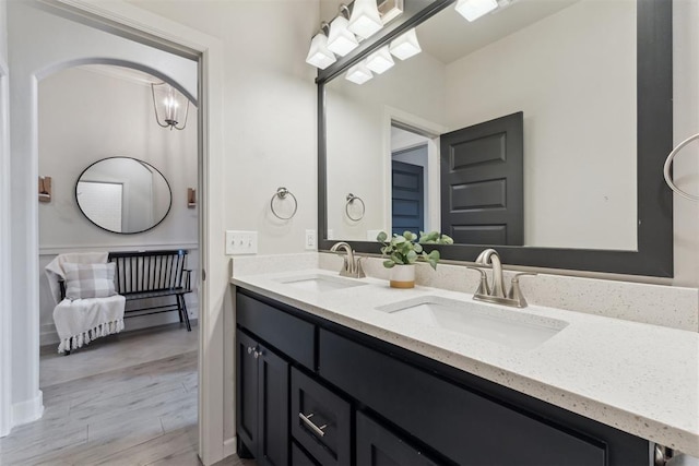 18813 Windy Way Rd, Edmond, OK 73012 - bathroom with double vanity and wood finished floors