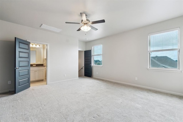 18813 Windy Way Rd, Edmond, OK 73012 - unfurnished bedroom featuring baseboards, light carpet, ensuite bath, and ceiling fan