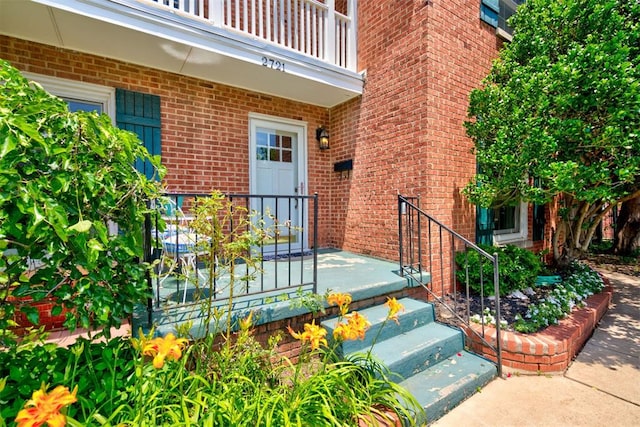 2721 NW 45th St, Oklahoma City, OK 73112 - entrance to property featuring brick siding and a balcony