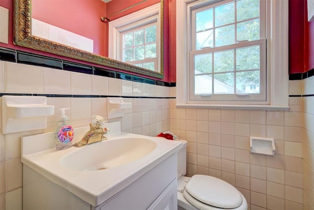 2721 NW 45th St, Oklahoma City, OK 73112 - bathroom with tile walls and vanity