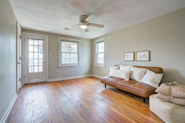 2721 NW 45th St, Oklahoma City, OK 73112 - living room featuring light wood-type flooring, plenty of natural light, and a ceiling fan