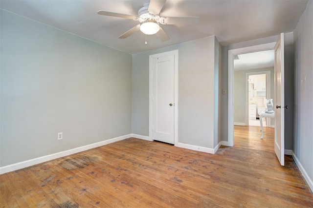 2721 NW 45th St, Oklahoma City, OK 73112 - unfurnished bedroom with light wood-type flooring, a closet, and a ceiling fan