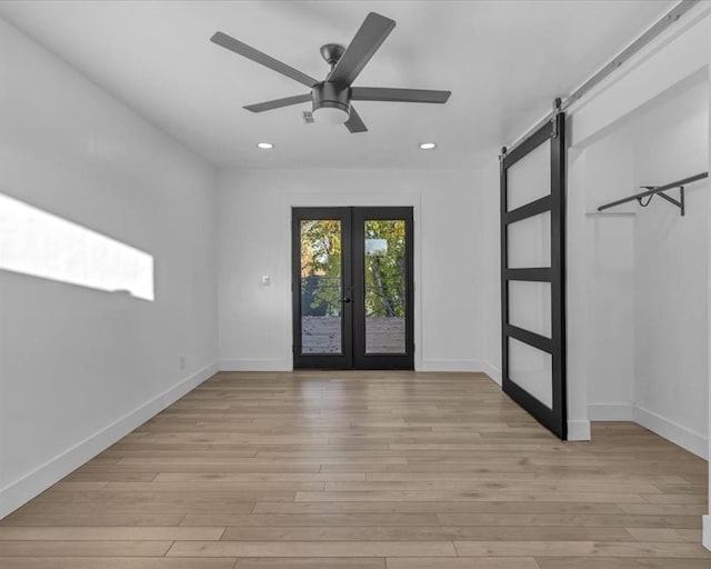 21700 N Rockwell Ave, Edmond, OK 73012 - spare room featuring french doors, a ceiling fan, recessed lighting, light wood finished floors, and baseboards