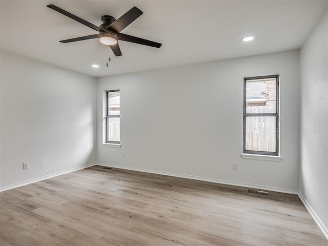 4709 Wilcox Ln, Yukon, OK 73099 - empty room with light wood finished floors, a ceiling fan, recessed lighting, and baseboards