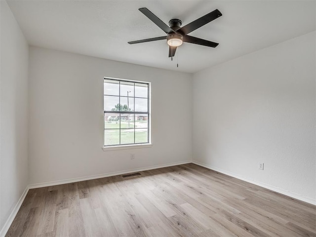 4709 Wilcox Ln, Yukon, OK 73099 - unfurnished room featuring wood finished floors, ceiling fan, and baseboards