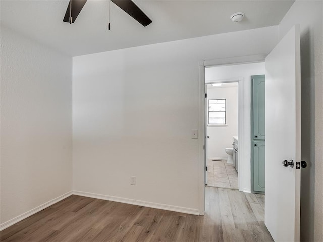 4709 Wilcox Ln, Yukon, OK 73099 - spare room with light wood-style floors, ceiling fan, baseboards, and a smoke detector
