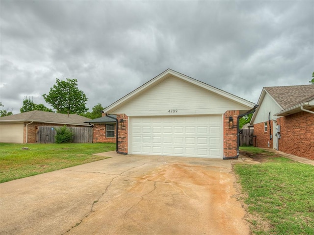 4709 Wilcox Ln, Yukon, OK 73099 - view of front facade with a garage and brick siding