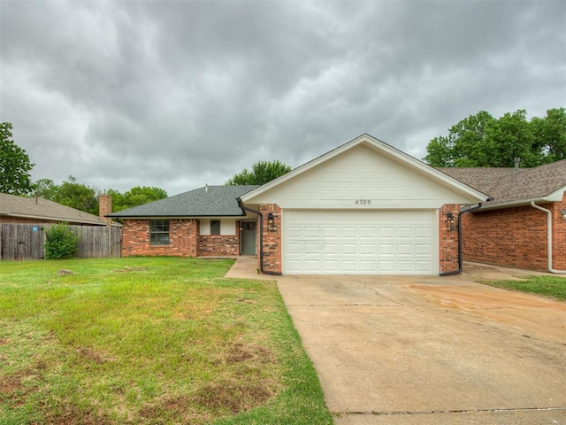 4709 Wilcox Ln, Yukon, OK 73099 - ranch-style home featuring an attached garage, driveway, brick siding, and a shingled roof