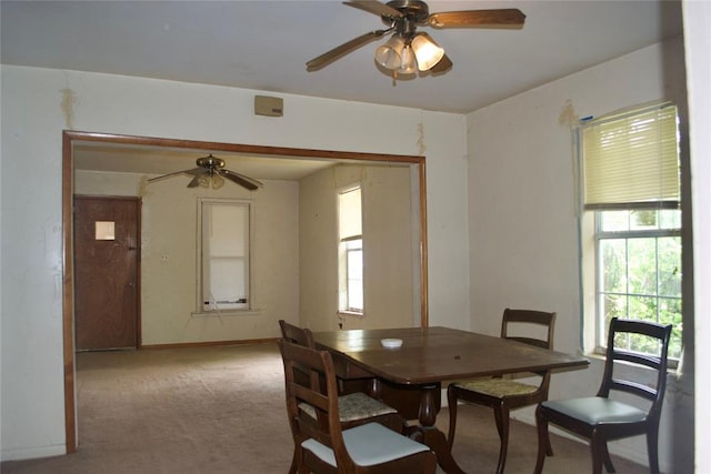 1014 S Dewey Ave, Chandler, OK 74834 - dining space with a ceiling fan, plenty of natural light, and carpet