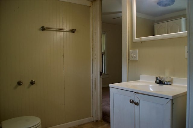 1014 S Dewey Ave, Chandler, OK 74834 - bathroom featuring vanity, toilet, and baseboards