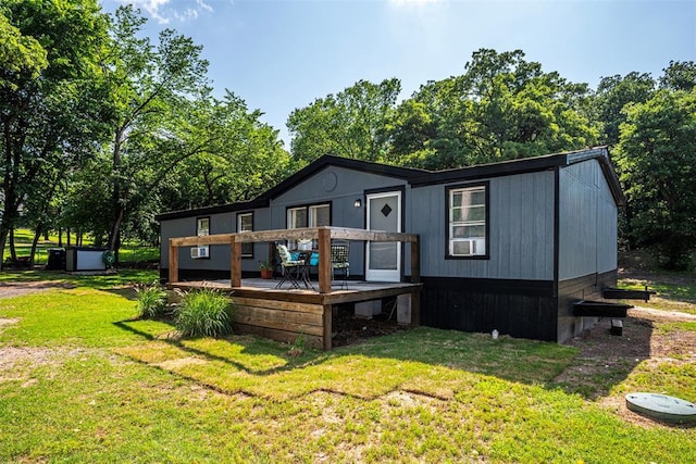 13903 Pleasant Ridge Rd, Jones, OK 73049 - back of property featuring a deck, a yard, and view of scattered trees