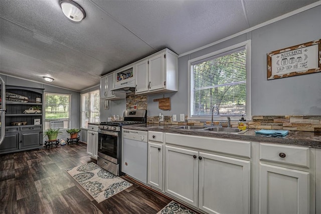 13903 Pleasant Ridge Rd, Jones, OK 73049 - kitchen featuring stainless steel gas stove, a sink, a textured ceiling, dark countertops, and dark wood-style flooring