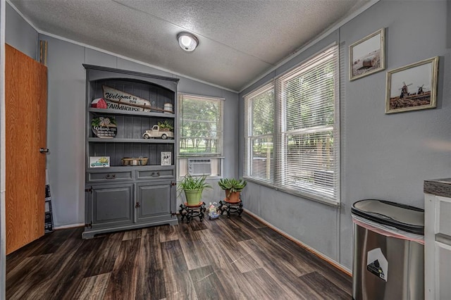 13903 Pleasant Ridge Rd, Jones, OK 73049 - dining area featuring vaulted ceiling, dark wood-style flooring, a textured ceiling, cooling unit, and crown molding