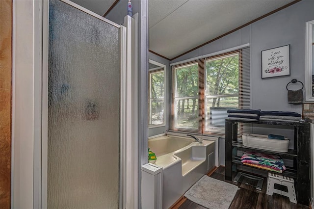 13903 Pleasant Ridge Rd, Jones, OK 73049 - full bathroom featuring vaulted ceiling, a stall shower, wood finished floors, a garden tub, and crown molding