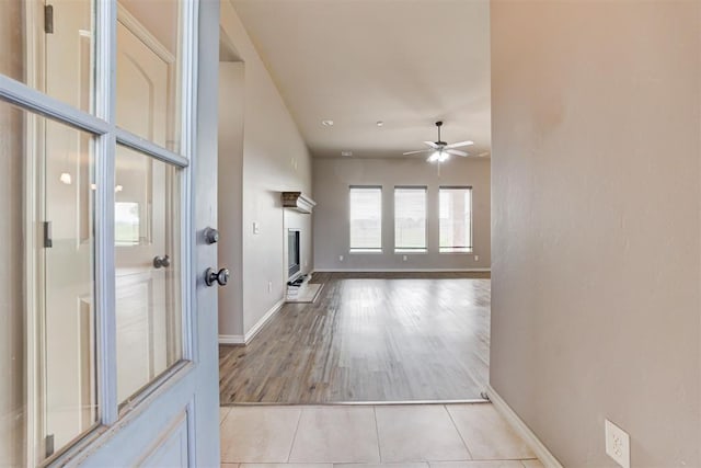 7720 Hawk Ln, Guthrie, OK 73044 - corridor featuring baseboards and light tile patterned floors