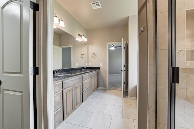 7720 Hawk Ln, Guthrie, OK 73044 - full bathroom with double vanity, a ceiling fan, baseboards, and tile patterned flooring