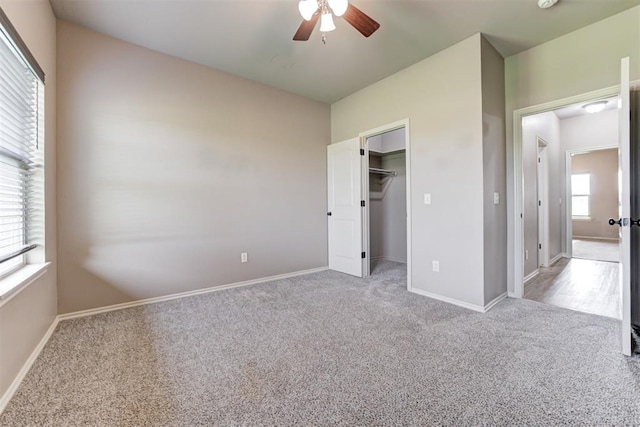 7720 Hawk Ln, Guthrie, OK 73044 - unfurnished bedroom with carpet, baseboards, a ceiling fan, and a spacious closet