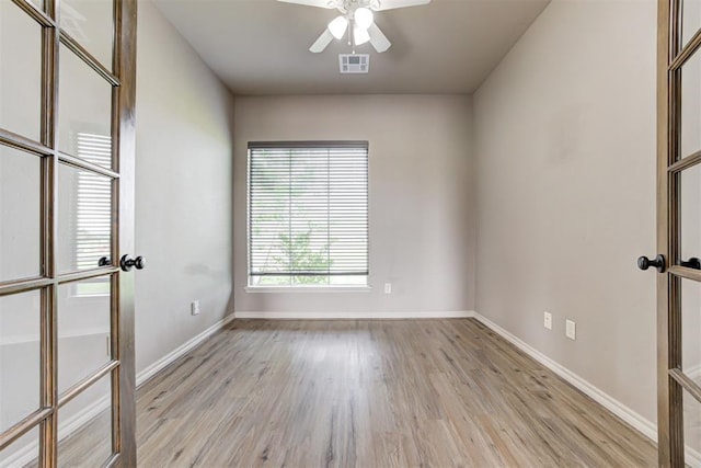 7720 Hawk Ln, Guthrie, OK 73044 - unfurnished room with a ceiling fan, light wood-type flooring, and baseboards
