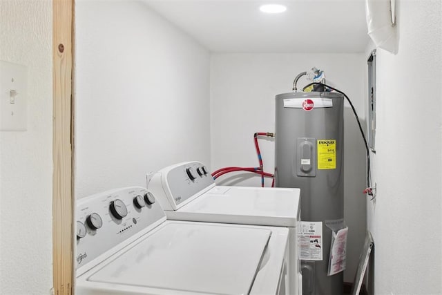21306 E 10th St, Hinton, OK 73047 - laundry area with electric water heater and washing machine and clothes dryer