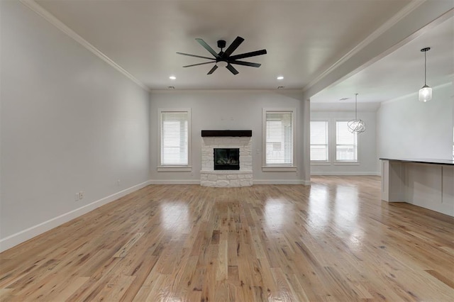 1108 Samantha Ln, Oklahoma City, OK 73160 - unfurnished living room with plenty of natural light, baseboards, light wood finished floors, ornamental molding, and ceiling fan