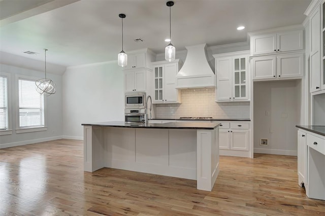 1108 Samantha Ln, Oklahoma City, OK 73160 - kitchen featuring stainless steel appliances, baseboards, wall chimney exhaust hood, dark countertops, and tasteful backsplash