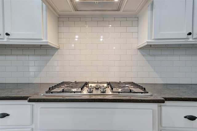 1108 Samantha Ln, Oklahoma City, OK 73160 - kitchen featuring stainless steel gas cooktop, white cabinetry, decorative backsplash, and dark stone countertops