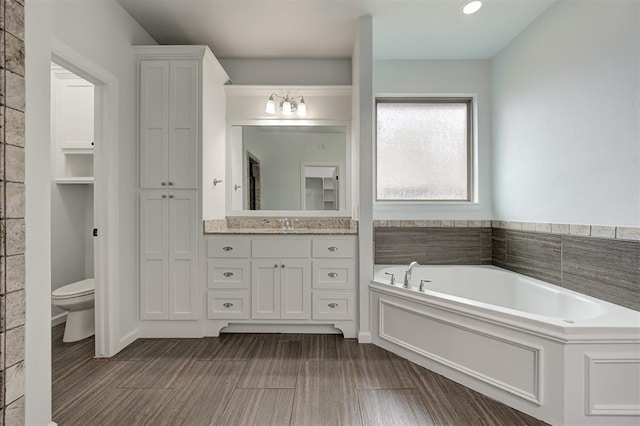 1108 Samantha Ln, Oklahoma City, OK 73160 - bathroom with a garden tub, vanity, and toilet
