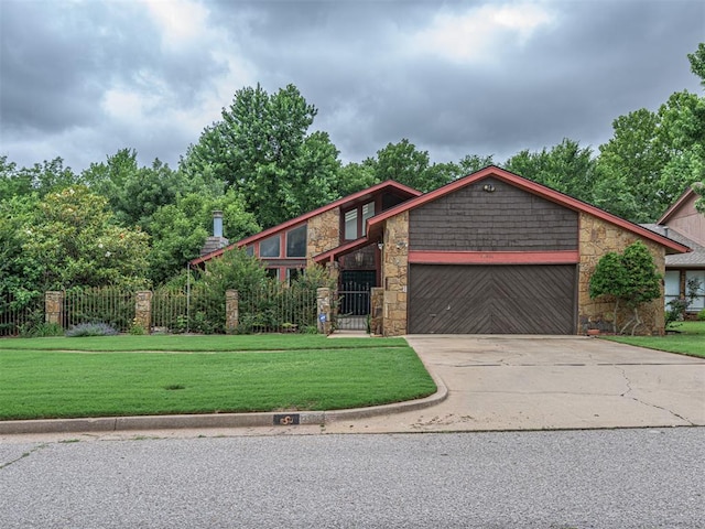 13501 Fox Hollow Rdg, Oklahoma City, OK 73131 - view of front of house featuring stone siding, an attached garage, and concrete driveway