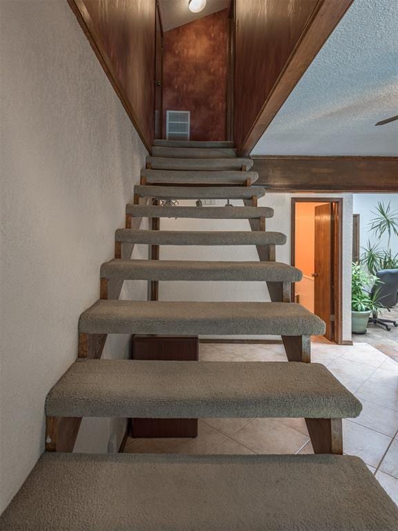 13501 Fox Hollow Rdg, Oklahoma City, OK 73131 - stairway featuring a textured wall and tile patterned floors