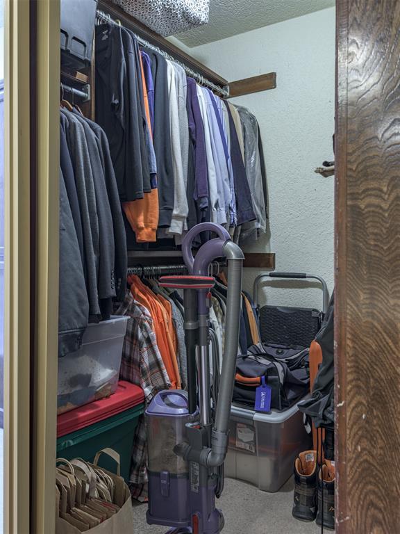 13501 Fox Hollow Rdg, Oklahoma City, OK 73131 - spacious closet featuring carpet