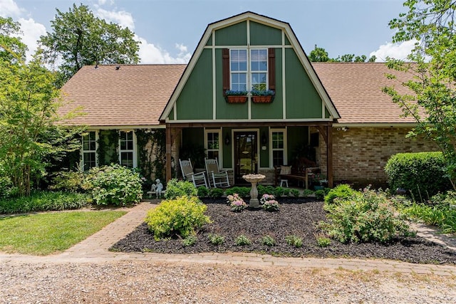 3824 Smoking Oaks Dr, Oklahoma City, OK 73150 - view of front of property with a porch, brick siding, and a shingled roof