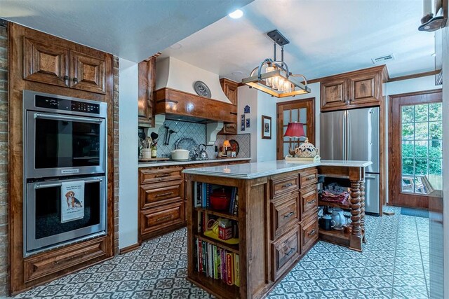 3824 Smoking Oaks Dr, Oklahoma City, OK 73150 - kitchen with appliances with stainless steel finishes, light countertops, open shelves, backsplash, and a center island