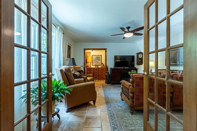 3824 Smoking Oaks Dr, Oklahoma City, OK 73150 - living area featuring stone tile flooring, ceiling fan, and french doors