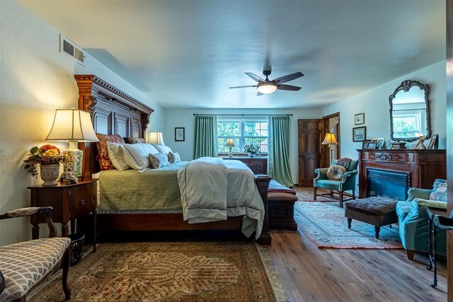 3824 Smoking Oaks Dr, Oklahoma City, OK 73150 - bedroom featuring wood finished floors and ceiling fan