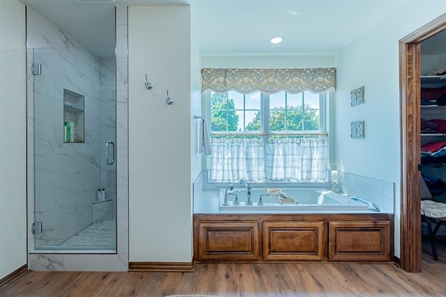 3824 Smoking Oaks Dr, Oklahoma City, OK 73150 - full bathroom featuring a garden tub, a marble finish shower, wood finished floors, and baseboards