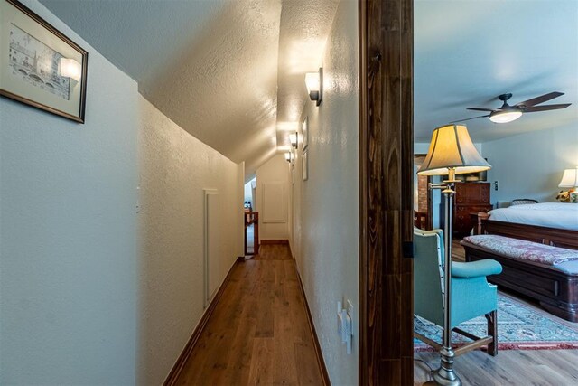 3824 Smoking Oaks Dr, Oklahoma City, OK 73150 - hallway with wood finished floors and a textured wall