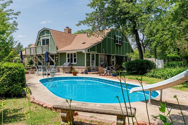 3824 Smoking Oaks Dr, Oklahoma City, OK 73150 - view of pool with a patio, a water slide, and grilling area