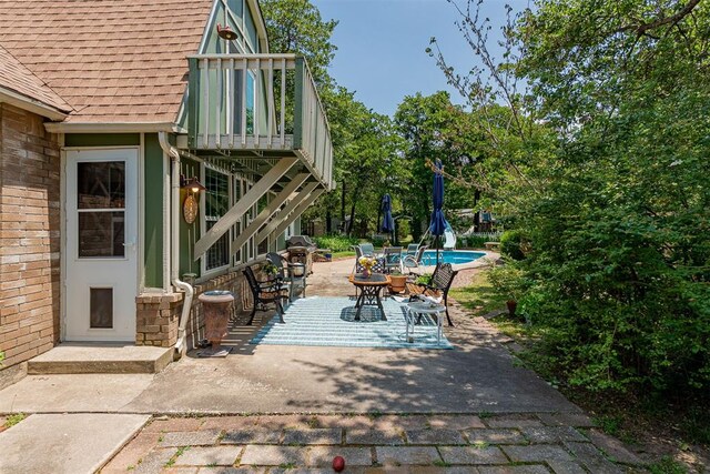 3824 Smoking Oaks Dr, Oklahoma City, OK 73150 - view of patio / terrace with an outdoor pool and outdoor dining area