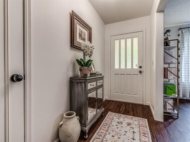 2009 Bella Vista Dr, Edmond, OK 73013 - doorway featuring dark wood-type flooring and baseboards