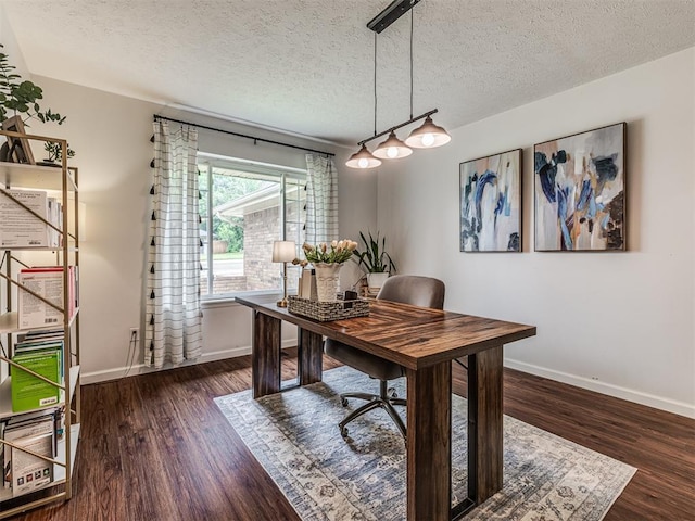 2009 Bella Vista Dr, Edmond, OK 73013 - home office featuring baseboards, wood finished floors, and a textured ceiling