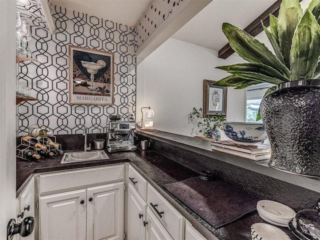 2009 Bella Vista Dr, Edmond, OK 73013 - kitchen with a sink, white cabinets, and dark countertops