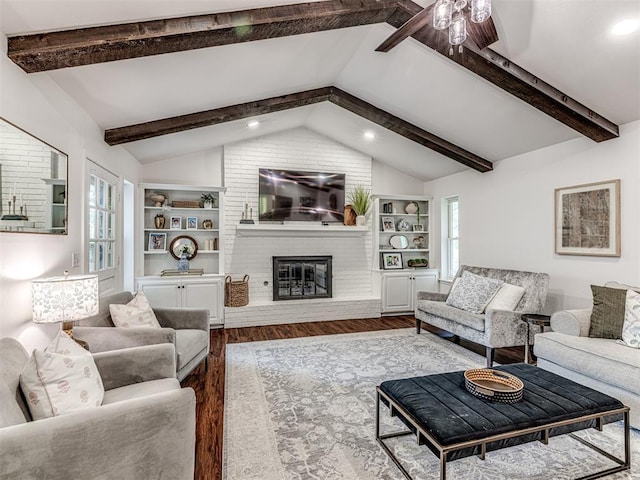 2009 Bella Vista Dr, Edmond, OK 73013 - living area with wood finished floors, a brick fireplace, ceiling fan, recessed lighting, and built in shelves