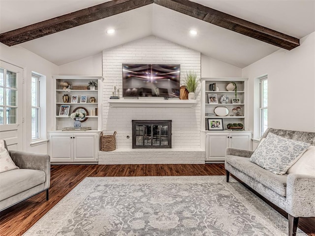 2009 Bella Vista Dr, Edmond, OK 73013 - living area featuring a brick fireplace, dark wood finished floors, and built in features