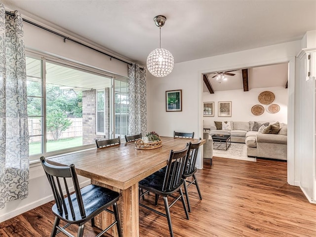 2009 Bella Vista Dr, Edmond, OK 73013 - dining area featuring light wood-style floors, baseboards, a ceiling fan, and a chandelier
