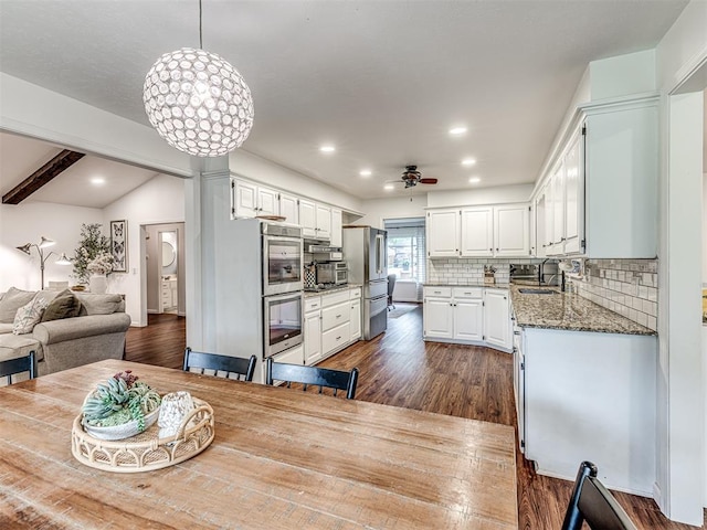 2009 Bella Vista Dr, Edmond, OK 73013 - dining space with a ceiling fan, dark wood finished floors, and recessed lighting